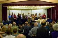June: Ian Russell leads the singing at The Festival of Village Carols at the Community Centre