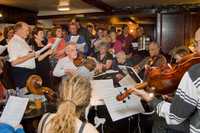 November: Carol singing in The Old Harrow