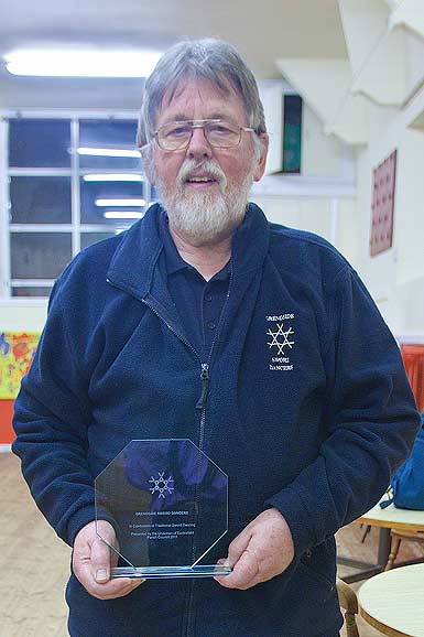 +right Gerry Bates with the award he accepted on behalf of the team